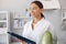 Beautiful doctor in a kitchen with a vegetables