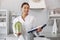 Beautiful doctor in a kitchen with a vegetables