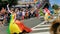 Beautiful drag queen walking and waving in a colorful dress, LGBT pride parade antwerp, 6 august, 2019, Antwerpen, Belgium