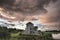 Beautiful dramatic clouds formation over lake landscape immediately prior to violent storm