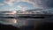 Beautiful dramatic clouds over the sea during sunset, baltic sea sandy coast