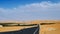 Beautiful dramatic clouds sunset sunrise time lapse over road in the desert sand dune of Abu Dhabi, UAE