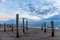 Beautiful dramatic cloudy sky over the woodn piles from the beach