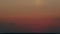 Beautiful dramatic fiery sunset over horizon in field in colorful sky. Sunset in yellow sky. Timelapse.