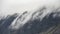 Beautiful dramatic Lake District landscape image of thick low cloud hanging over Illgill Head in wasdale Valley giving a very