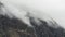 Beautiful dramatic Lake District landscape image of thick low cloud hanging over Illgill Head in wasdale Valley giving a very