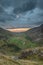 Beautiful dramatic landscape image of Nant Francon valley in Snowdonia during sunset in Autumn