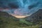 Beautiful dramatic landscape image of Nant Francon valley in Snowdonia during sunset in Autumn