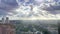 A beautiful and dramatic panoramic shot of the Rotterdam city skyline with a sun rays and spectacular dramatic clouds 