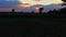 Beautiful dramatic sky of sunset at the dried harvested paddy field.