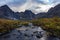 Beautiful Dramatic View of Rugged Mountains and Alpine River