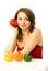 Beautiful dreamy woman with colorful peppers