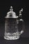 A beautiful drinking jug of crystal glass with tin cover