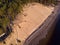 Beautiful drone areal photography view of large dune and pine forest near river Lielupe.