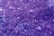 Beautiful druse of natural purple mineral amethyst close-up. Semiprecious stone background. Gem crystals