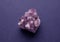 Beautiful druse of natural purple mineral amethyst  on a dark background. Large crystals of precious stones