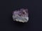 Beautiful druse of natural purple mineral amethyst on a gray background. Large crystals of a gem