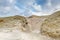 Beautiful dune scenery along Dutch North Sea coast with by wind carved   deep holes with steep walls