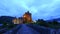 Beautiful dusk at illuminated Eilean Donan Castle over the lake in Scotland