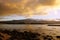 Beautiful Dusk over the ocean with waves moving to rocky shore a