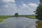 Beautiful dutch idyllic tranquil countryside landscape, green meadow trees. The Netherlands