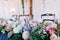 Beautiful dÃ©cor of fresh pink, white, blue flowers on the restaurant table, wedding reception