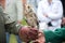 Beautiful eared owl with orange eyes sitting on his hand in a glove