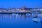 Beautiful early morning view of boats and yachts in West Pier of famous Dun Laoghaire harbor during blue hour before sunrise