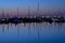 Beautiful early morning view of boats and yachts in West Pier of famous Dun Laoghaire harbor during the blue hour before sunrise