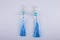 Beautiful earrings on a light gray background.