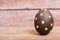 Beautiful Easter Brown egg on wooden