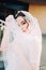 Beautiful eastern style bride with white veil and hairpiece