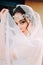 Beautiful eastern style bride with white veil and hairpiece