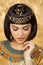 Beautiful Egyptian woman like Cleopatra on golden background