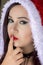 Beautiful Egyptian woman in Santa Claus costume