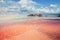 Beautiful Elafonissi beach on Crete, Greece. Pink sand, blue sea water and clouds sky