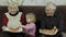 Beautiful elderly man and woman eats pizza with their granddaughter