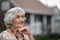 A beautiful elderly walks near their house