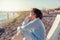 Beautiful elderly woman sitting in a deckchair on the beach and