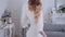 Beautiful elegant bride in a simple white wedding dress