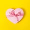 Beautiful elegant Present Gift in Heart Shape on Yellow colorful