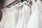 Beautiful elegant white luxury bridal dress on hangers. Generative AI