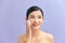 Beautiful elegant woman with bare shoulders on color isolated background clean skin spa treatments