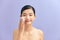 Beautiful elegant woman with bare shoulders on color isolated background clean skin spa treatments
