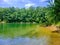 Beautiful emerald green calm water in a quite lagoon on the big lake