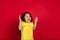 Beautiful emotional little girl isolated on red background. Half-lenght portrait of happy child gesturing