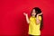 Beautiful emotional little girl isolated on red background. Half-lenght portrait of happy child gesturing