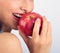 Beautiful emotional woman biting the red tasty apple. Part of be