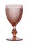 beautiful empty pink wine glass. the shape of the glass is reminiscent of old-fashioned textured dishes. on white backgro