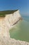 Beautiful English coastline Seaford East Sussex England uk with white chalk cliffs, waves and blue sky